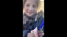 Afghan child overjoyed as woman buys all pens she is selling on streets to make living