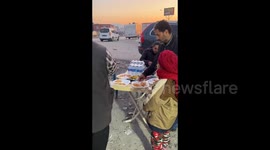 People help quake victims with free food in Antakya, Turkey