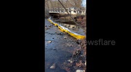 Concerned Ohio resident shows chemicals shimmering in stream near toxic train wreck