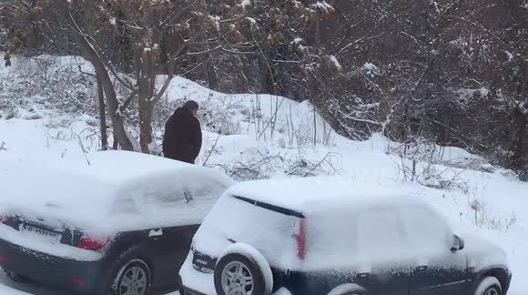 Guy goes to the loo in the snow in public