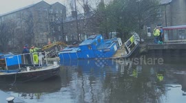 Boat rescued from canal bank after flooding