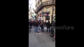 Public and press held back by police in Paris