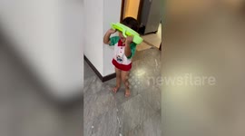 Scared little boy calls for help removing potty seat stuck on his head