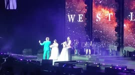 Brides still in gowns ditch their wedding reception to watch Irish pop group Westlife