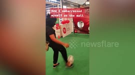 Woman's shoes fly off while trying football penalty kick challenge in Malaysia