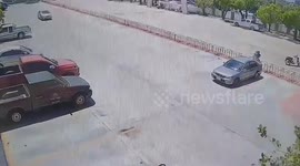 Car surges through parking lot and hits wall after 'owner left automatic gear in drive'