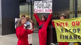 Climate activists stage protest against East African oil pipeline outside insurance companies in London