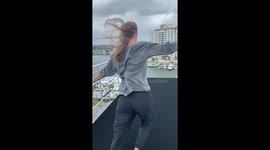 High diver walks on a 27m diving platform in the wind in Fort Lauderdale.