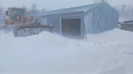 Loader cleans streets from snow in Howard, USA