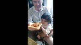 This cute 7 month old baby is growing up fast as she starts sampling various solid foods for the first time..