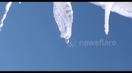 An ice cycle melting in the sun after a snow storm.