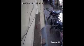 Roadside turned into big sinkhole in Delhi taking two bikes under it