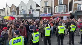A large group the the pro lgbt protesters band up together against the far right