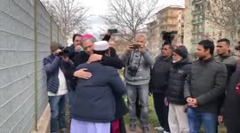 Italy shipwreck: Imam and bishop share long hug after prayer
