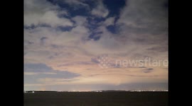 Faint Northern Lights colours seen in clouds above Kent, UK