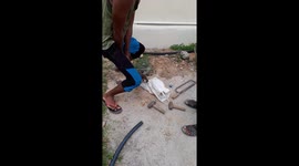 Repairman opening socket from old GI pipe in India . Old gi pipe repair work
