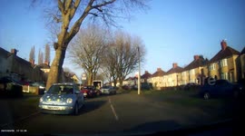 Accident: Driver Reverses Into Parked Vehicle While Trying to Give Way to Oncoming Car