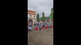 The challenge is to take a spoon with your mouth and then fill the bottle with water