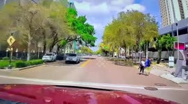 Downtown Saint Petersburg Fla driver in white van turn lane don’t pay attention