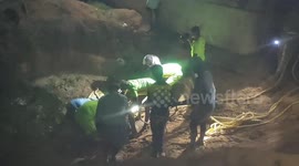 A cow that was struck in a pile of sludge was rescued in India