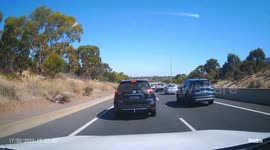 Reckless Driving: Bad Driver Cuts Through Traffic on a Busy Highway