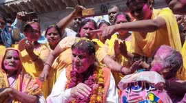 Sulabh International founder Dr Bindeshwar Pathak with widows of Vrindavan during a Holi celebration at Gopinath temple at Vrindavan