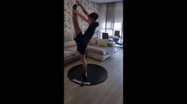 Skater flexes unreal balancing skills while spinning on portable floor