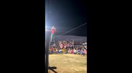 Man blindfolded and moving on the rope