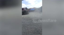 Dust devil tornado follows tuk-tuk driver in the Philippines