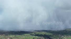 Snow Curtains Falling Over Countryside Today By Drone