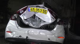 People inspect the wreckage of a building that was housing Palestinians and was hit by rockets during an Israeli army raid in the Jenin camp for Palestinian refugees in the West Bank