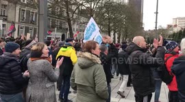 EDF-GDF demonstrators unflured huge flag at the protest in Nantes, France