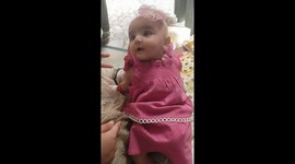 Its cuddling time . Cutie pie is enjoying her cuddle