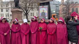 Iranians dress as handmaidens in London protest on International Women's Day