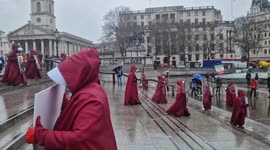 British-Iranians take part in poignant silent handmaid's march on International Women's Day
