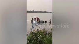 Brave residents rescue pilot and passenger after light plane crashes into pond in Thailand