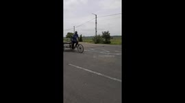 A Youth empty  Trolley Rickshaw  driving on road in Odisha .