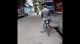 Indian man riding a bicycle on the road   Cycling on Indian Roads