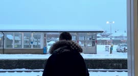 Commuters travel by train during severe snowfall in Leeds, West Yorkshire