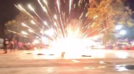 Revellers flee as flying lantern falls and erupts in shower of sparks during festival
