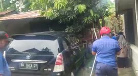 Padang city fire department evacuated a 4-meter python hiding on a platform after eating two chickens