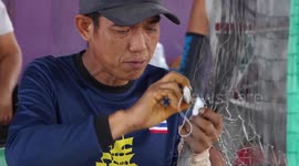 Villagers thrive on profitable fish net weaving business in Thailand