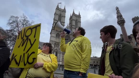 Protesters hold 'Not My King' signs outside Westminster Abbey on Commonwealth Day