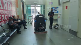 Travelers amazed with the auto floor cleaning machine new technology at KLIA2 AIRPORT Malaysia