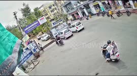 School child fell from running auto in between the road , bystanders ran for rescue