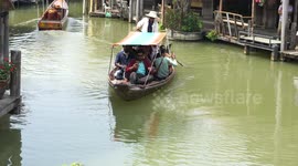 Indian tourists are happy to take a rowing boat at the Pattaya Floating Market.