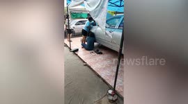 Kind family rescue and adopt stray cat stuck under car's fender