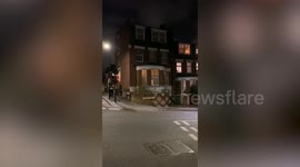 Council slammed for 'wasting taxpayers' money after sending as many as 10 security guards to put up a fence around a 120-year-old tree that residents are trying to stop being cut down