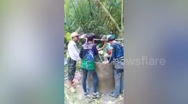 Rescuers rappel down 32ft well to save pet cat that fell while chasing rat