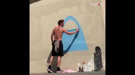 Graffiti artist gets rewarded with a ride in a cop car after pouring his heart out on a wall (without permission)